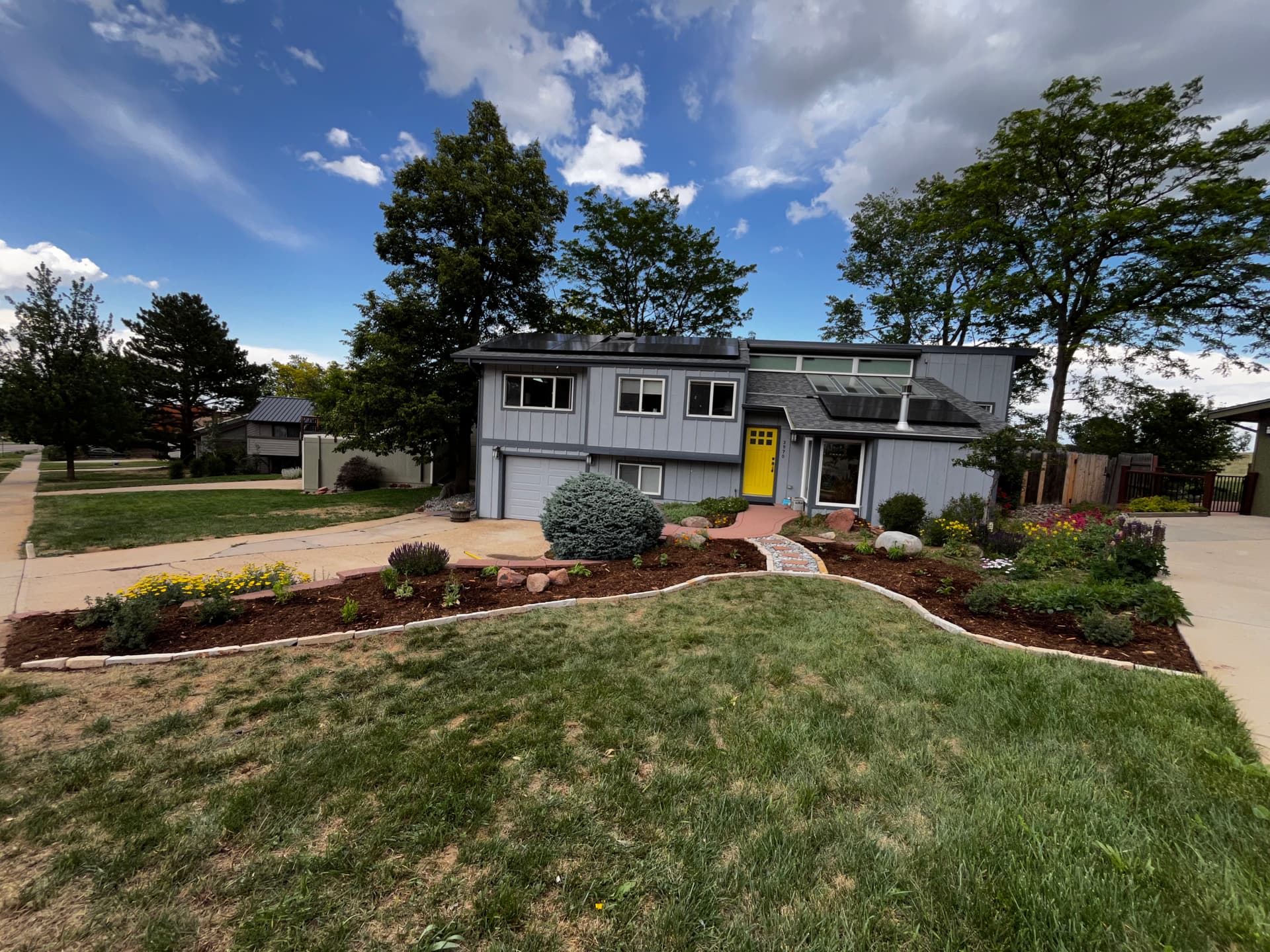 Lawn Reduction Done Right - Native Perennials, Boulders, and Zero Wasted Water